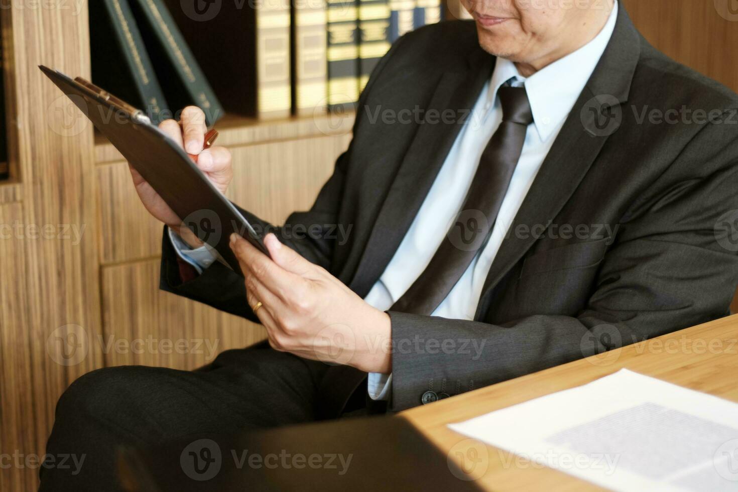 Legal counsel presents to the client a signed contract with gavel and legal law. justice and lawyer concept. photo