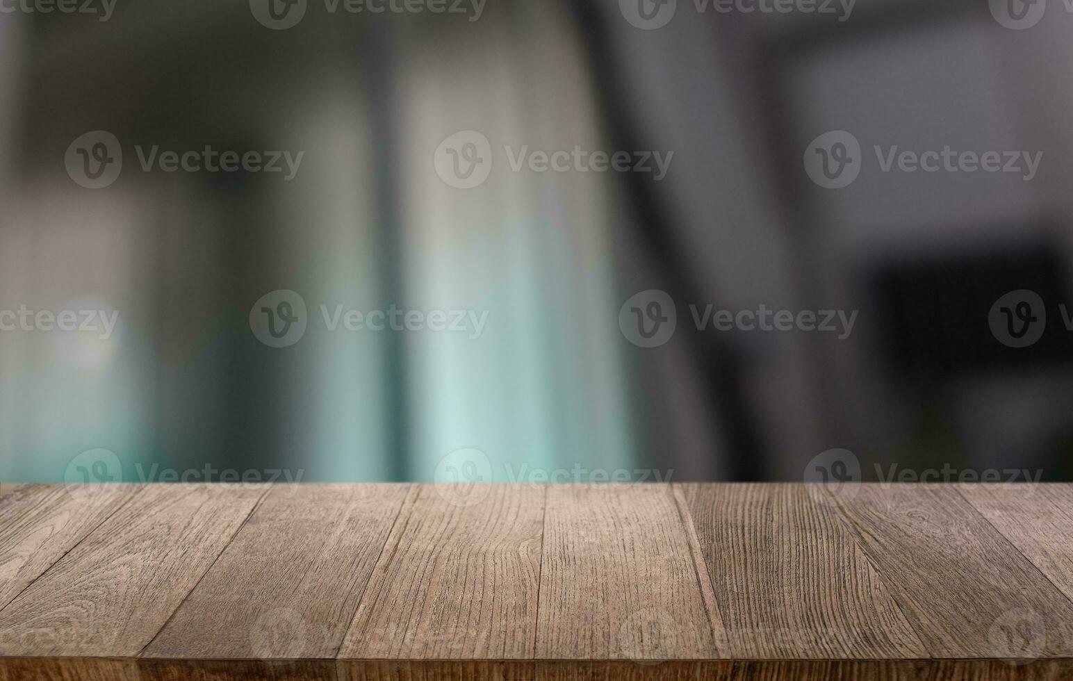 Empty wooden table in front of abstract blurred background of coffee shop . can be used for display or montage your products.Mock up for display of product photo