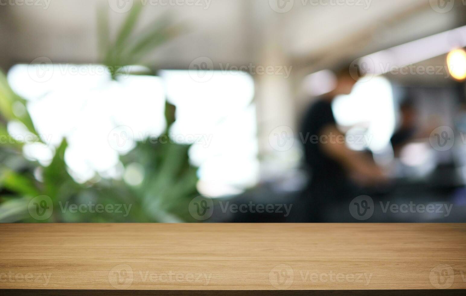 Wood Table Top in Blur Background room interior with empty copy space. photo