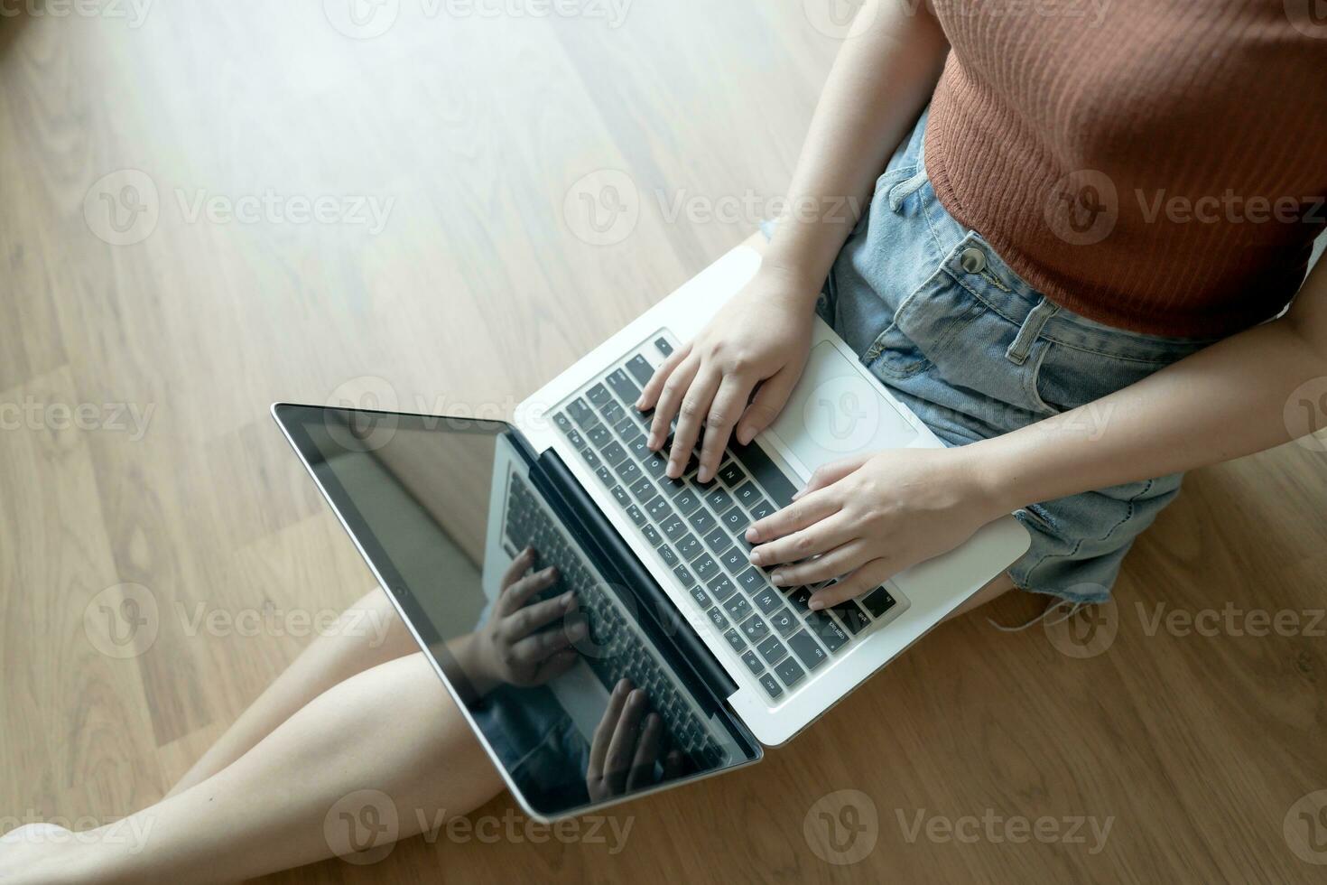 Woman Working by using laptop blank screen computer . Hands typing on a keyboard.technology e-commerce concept. photo
