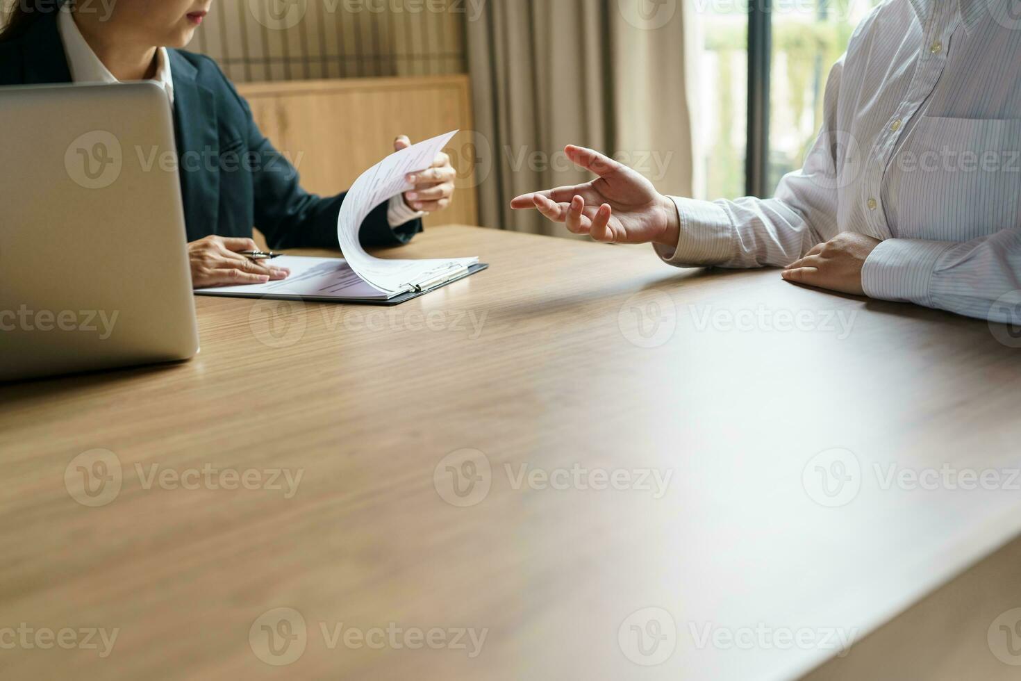 Examiner reading a resume during job interview at office Business and human resources concept photo