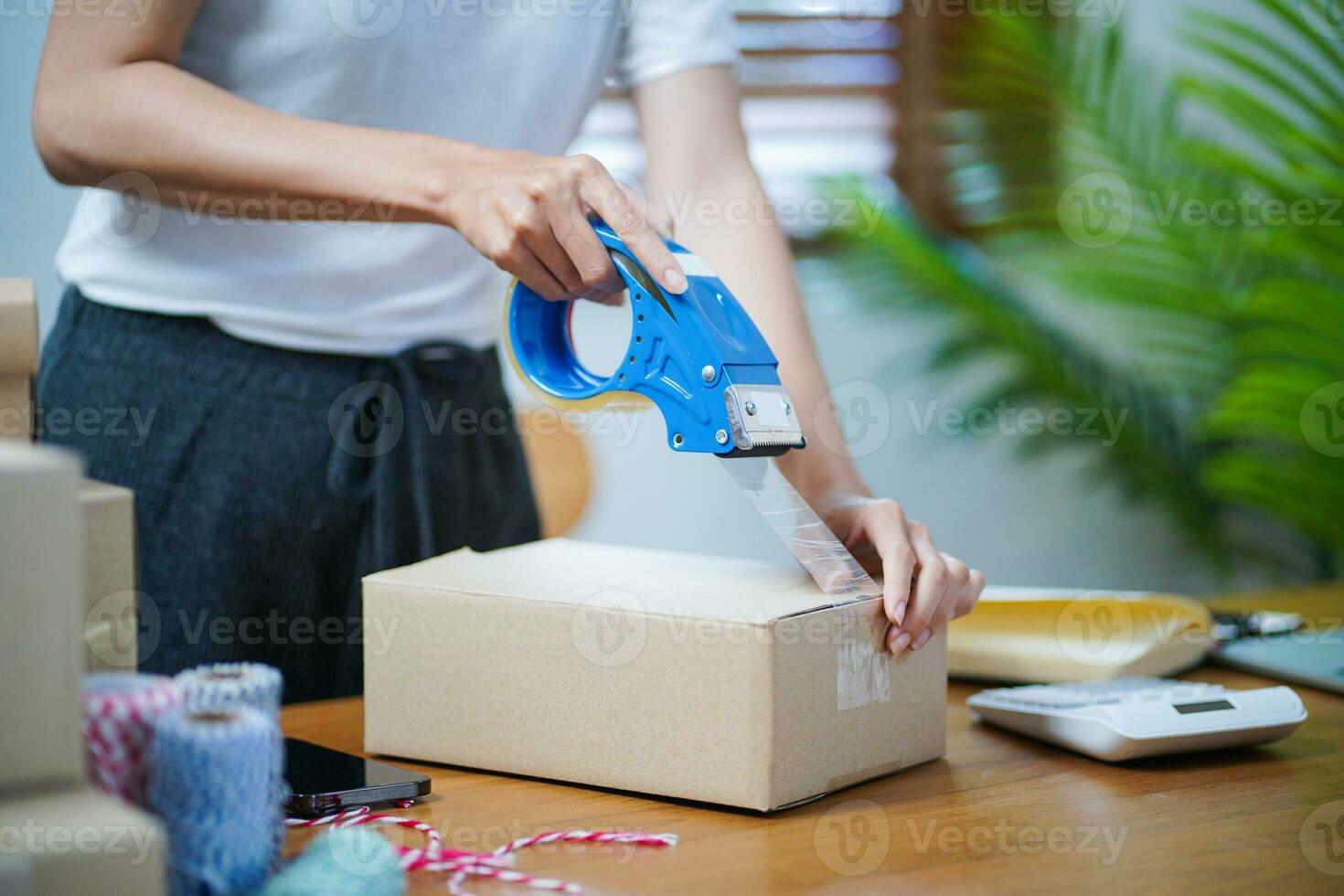 Asian woman preparing package delivery box Shipping for shopping online delivery mail service people and shipment concept photo