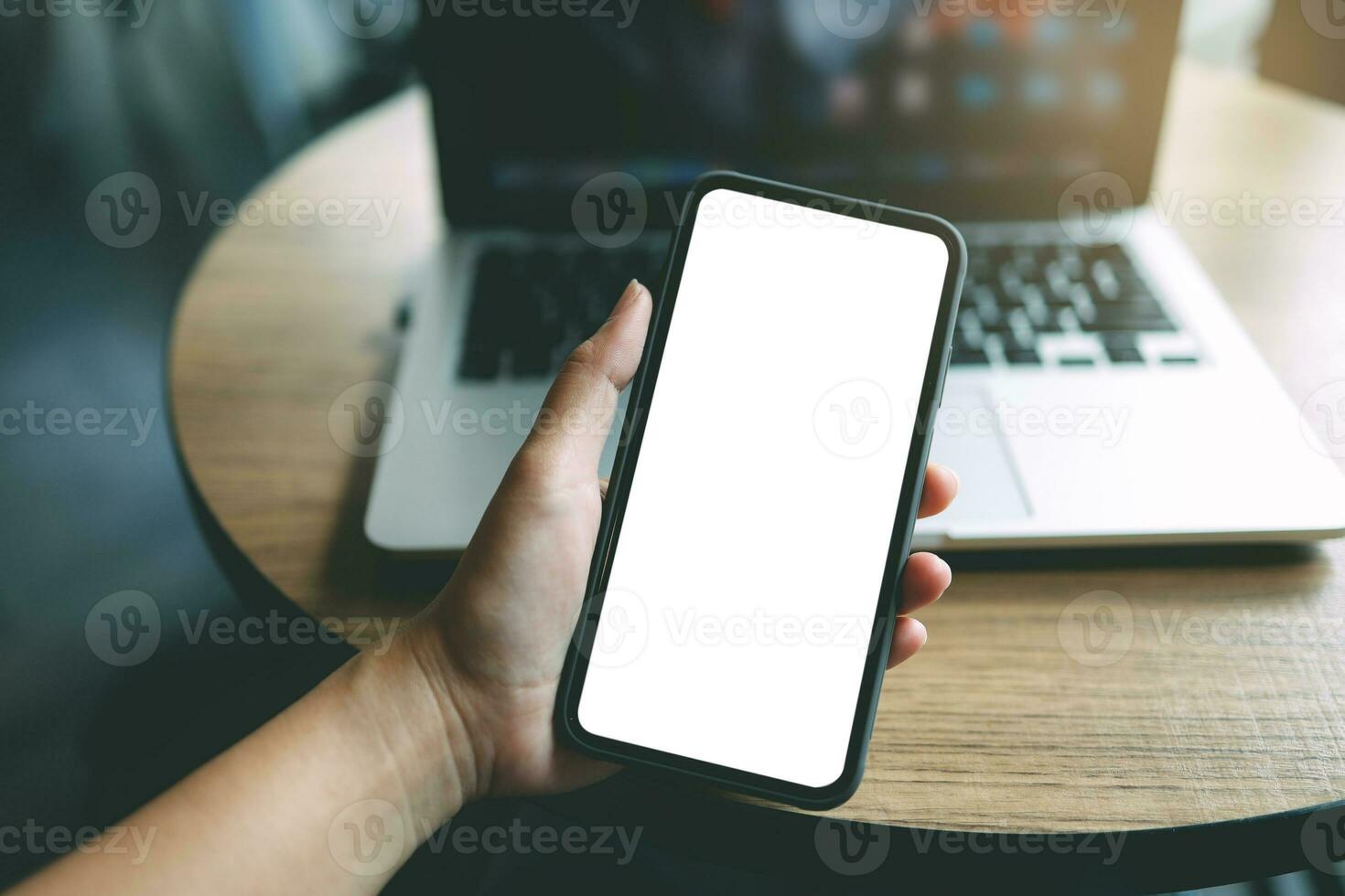 Women's hands holding cell telephone blank copy space screen. smartphone with blank white screen isolated on white background . smart phone with technology concept photo