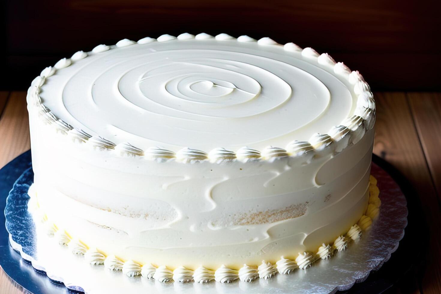 Birthday cake with white icing on top. Shallow depth of field. photo