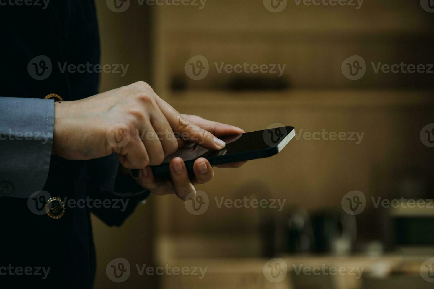 Mature businessman using a digital tablet to discuss information with a younger colleague in a modern business lounge photo