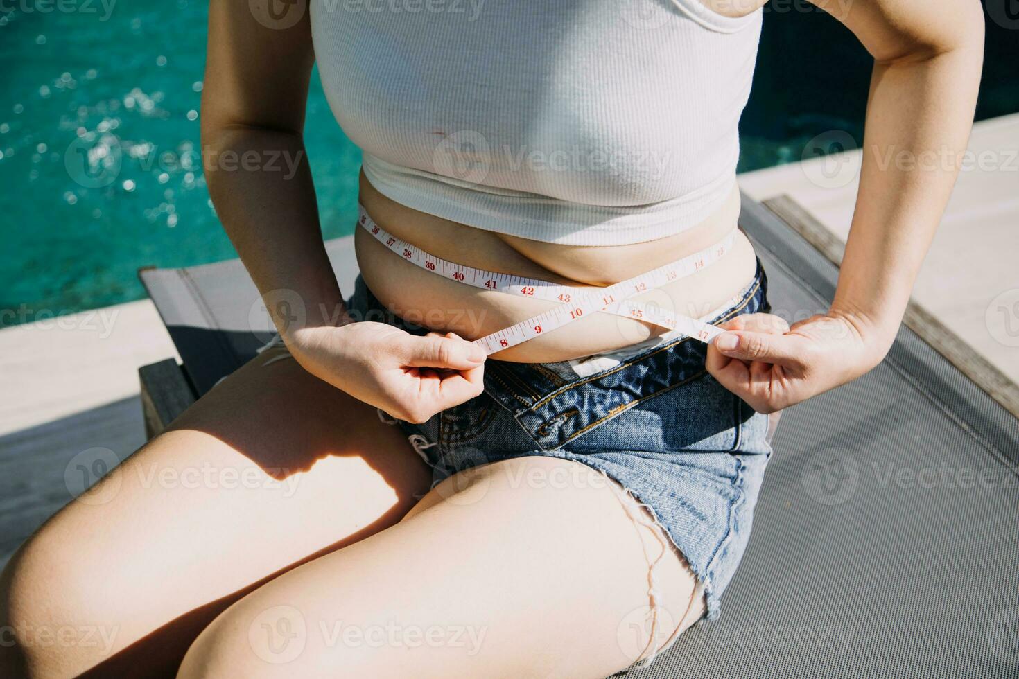 fat woman, fat belly, chubby, obese woman hand holding excessive belly fat with measure tape, woman diet lifestyle concept photo