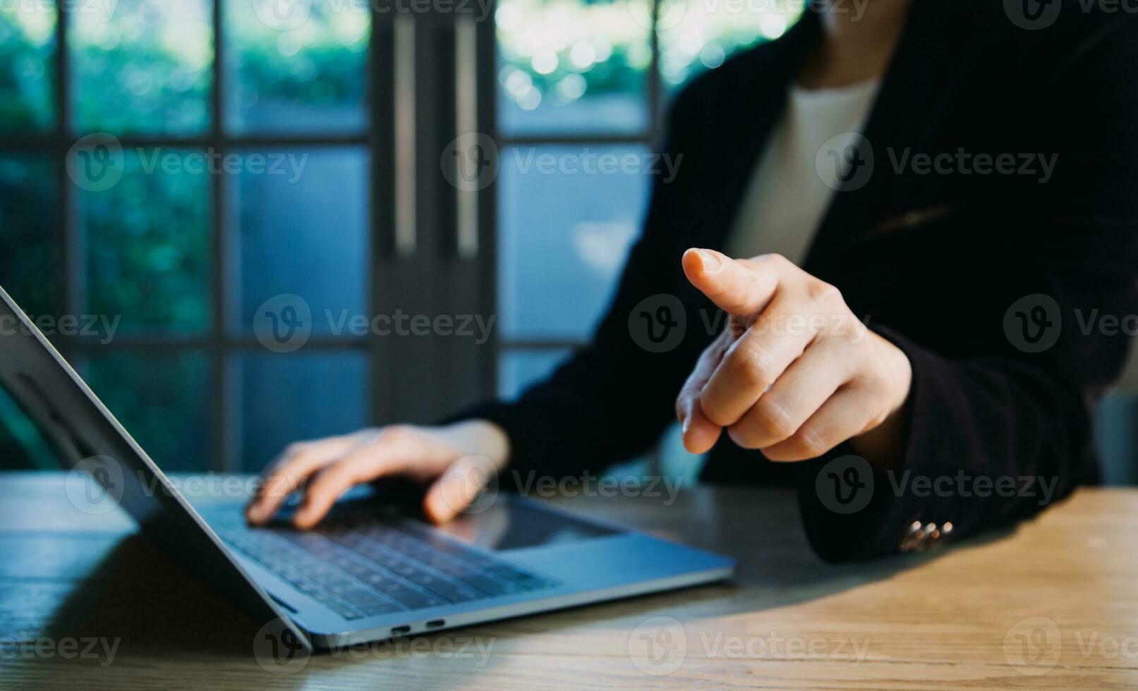 close up hands multitasking man using tablet, laptop and cellphone connecting wifi photo