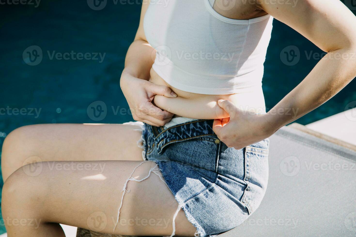 fat woman, fat belly, chubby, obese woman hand holding excessive belly fat with measure tape, woman diet lifestyle concept photo