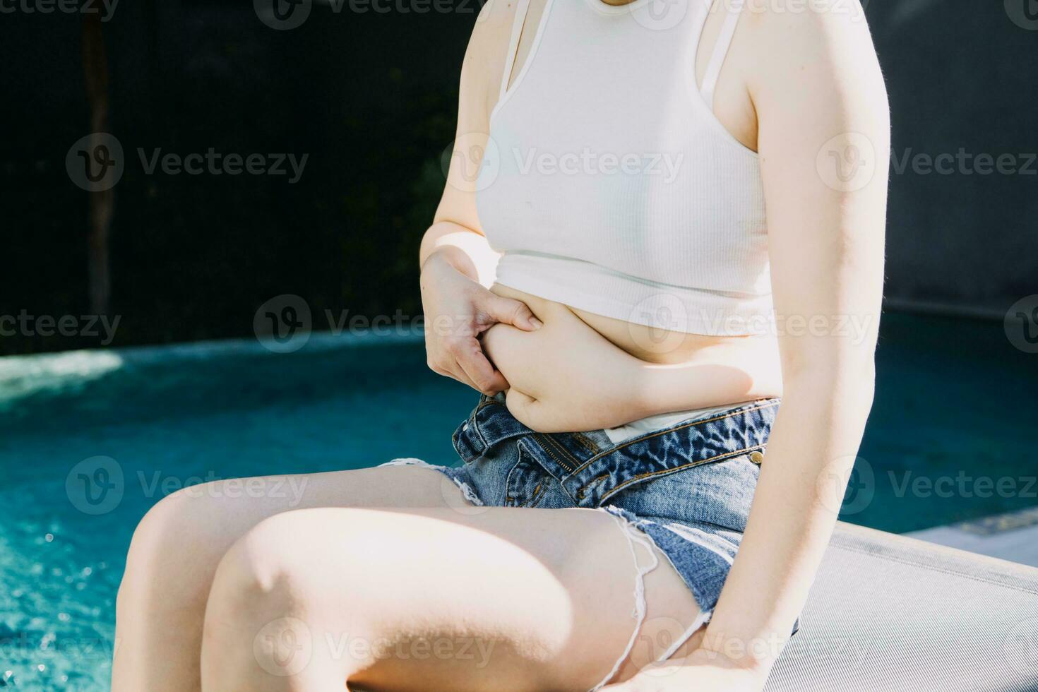 fat woman, fat belly, chubby, obese woman hand holding excessive belly fat with measure tape, woman diet lifestyle concept photo