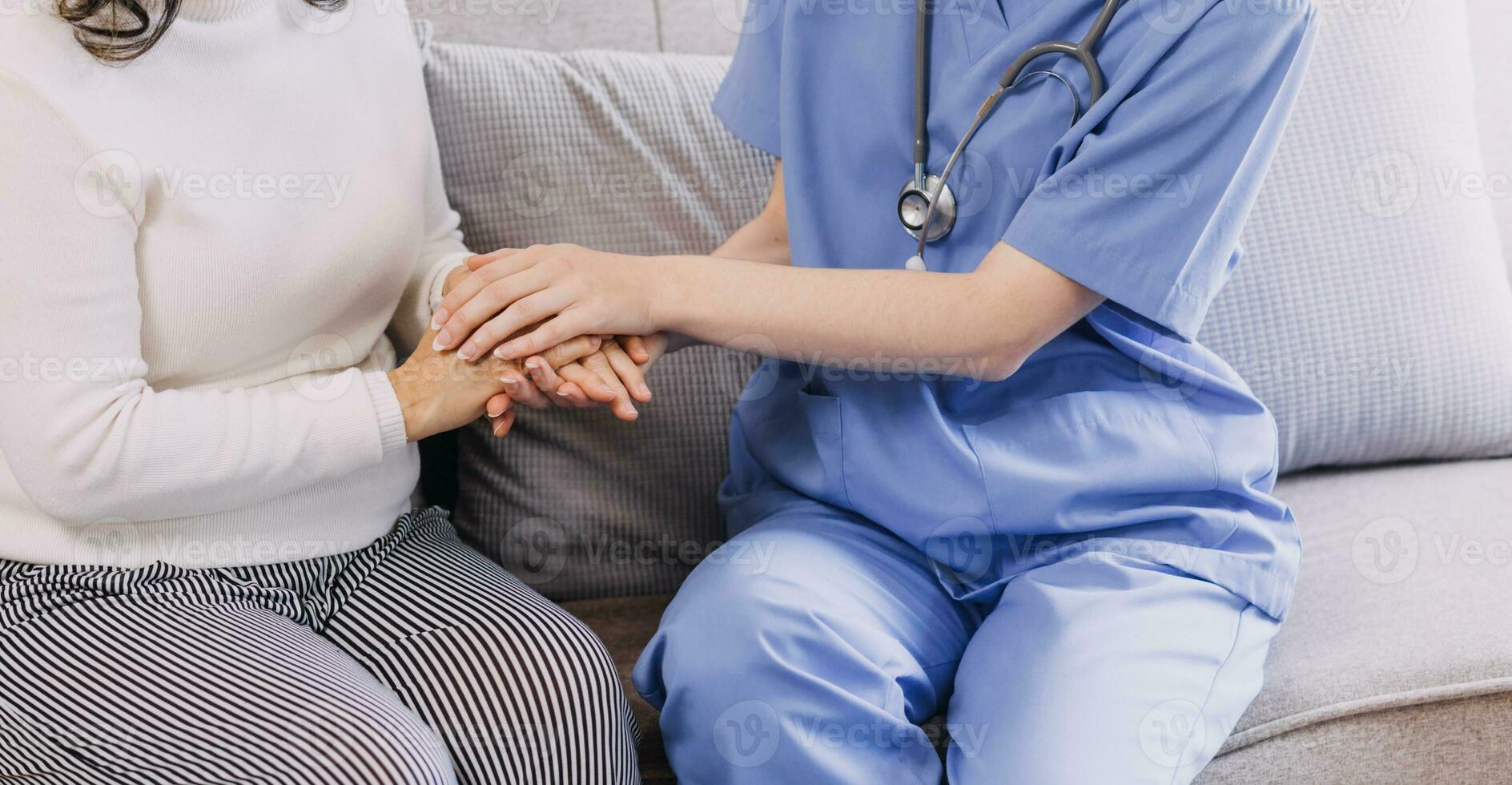 Homecare nursing service and elderly people cardiology healthcare. Close up of young hispanic female doctor nurse check mature caucasian man patient heartbeat using stethoscope during visit photo