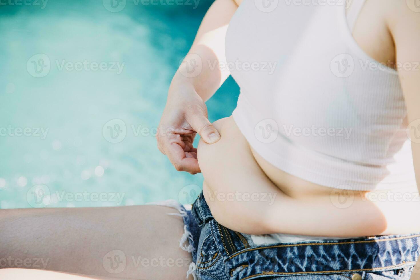 fat woman, fat belly, chubby, obese woman hand holding excessive belly fat with measure tape, woman diet lifestyle concept photo