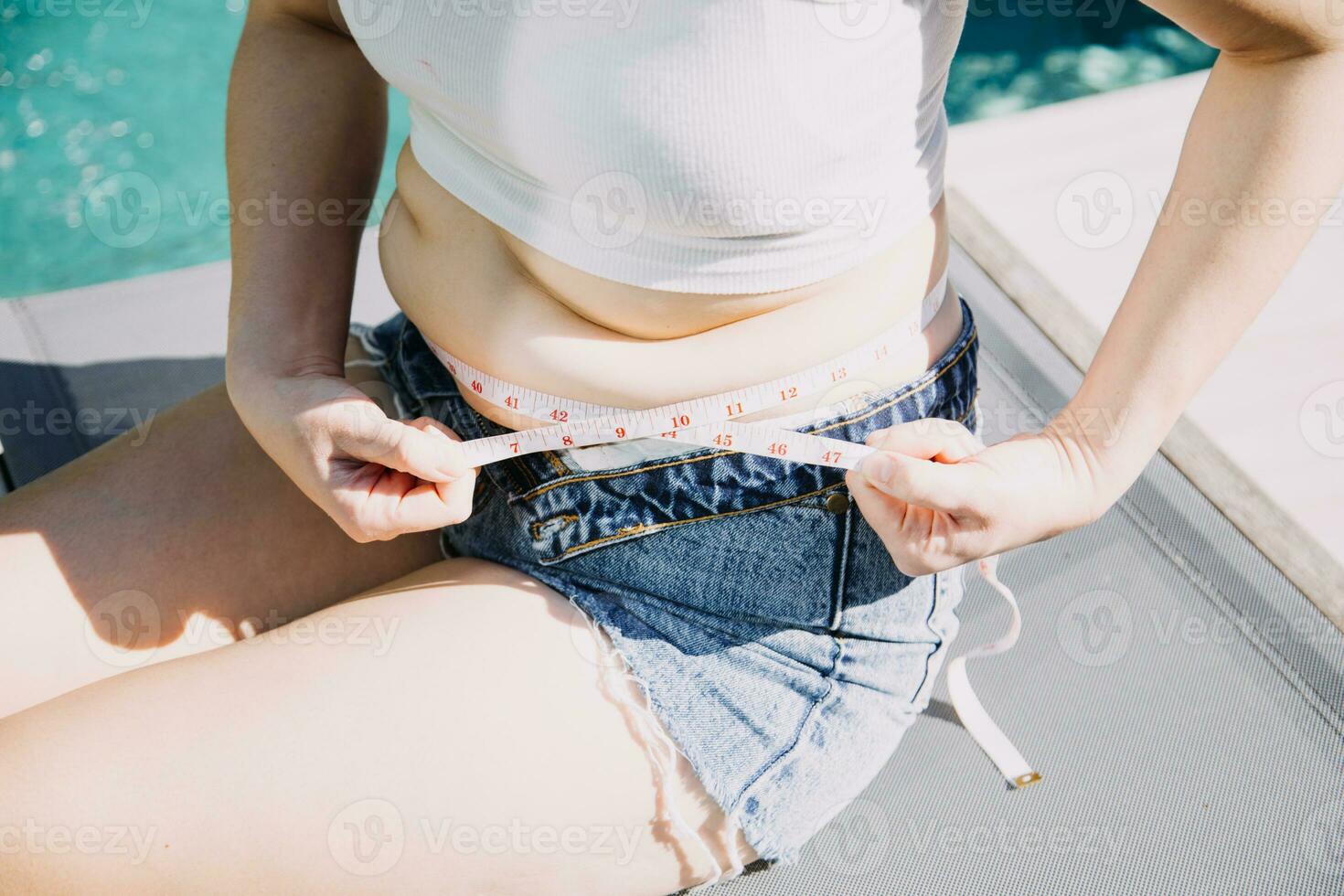 fat woman, fat belly, chubby, obese woman hand holding excessive belly fat with measure tape, woman diet lifestyle concept photo