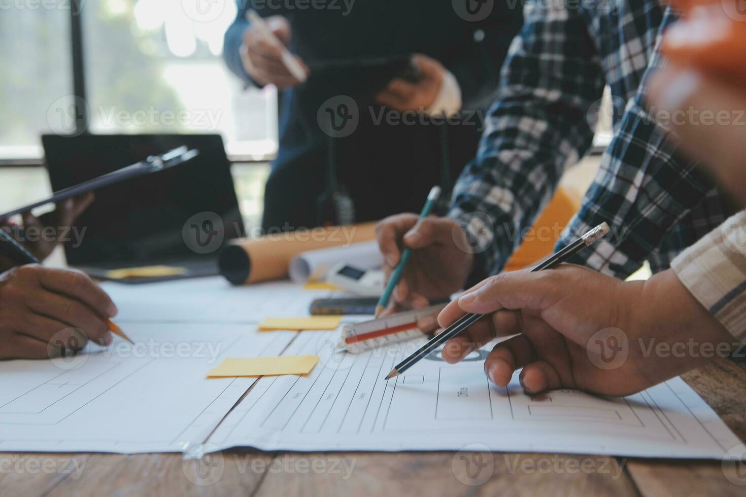 Construction and structure concept of Engineer or architect meeting for project working with partner and engineering tools on model building and blueprint in working site, contract for both companies. photo