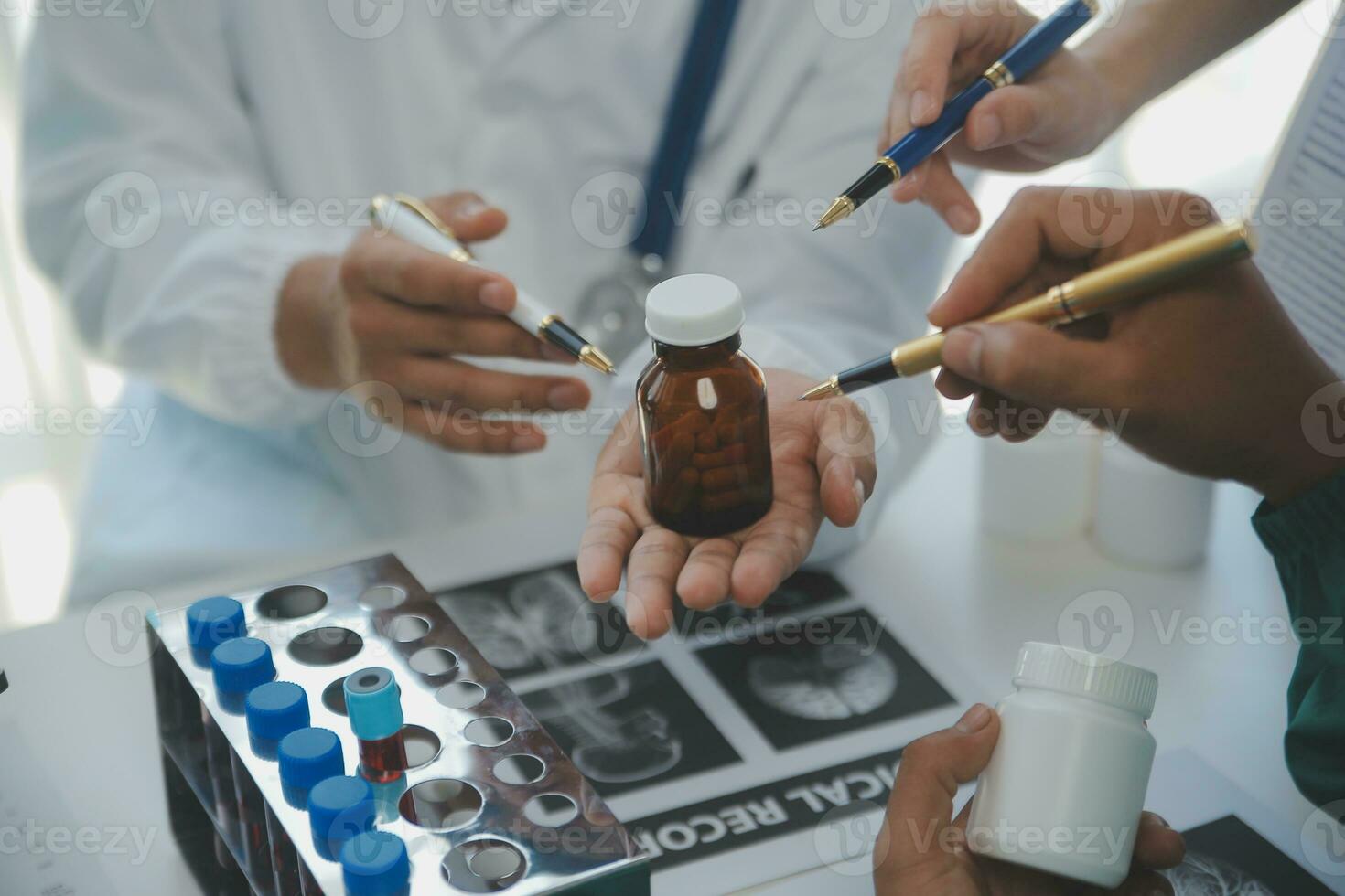 Medical technology network team meeting concept. Doctor hand working smart phone modern digital tablet laptop computer graphics chart interface, sun beams effect photo
