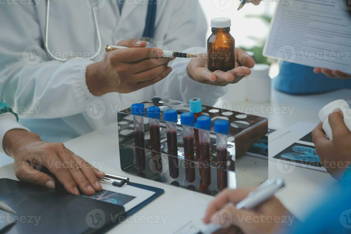 Medical technology network team meeting concept. Doctor hand working smart phone modern digital tablet laptop computer graphics chart interface, sun beams effect photo