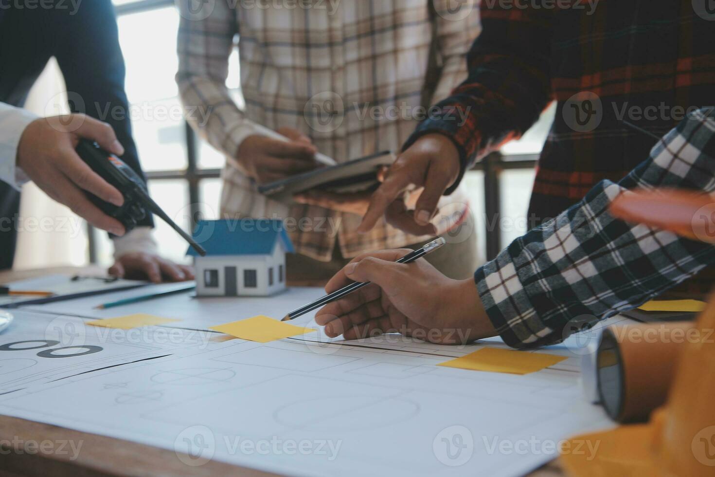 Engineer Teamwork Meeting, Drawing working on blueprint meeting for project working with partner on model building and engineering tools in working site, Construction and structure concept. photo