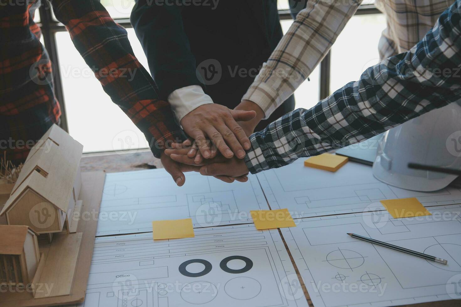 Engineer Teamwork Meeting, Drawing working on blueprint meeting for project working with partner on model building and engineering tools in working site, Construction and structure concept. photo