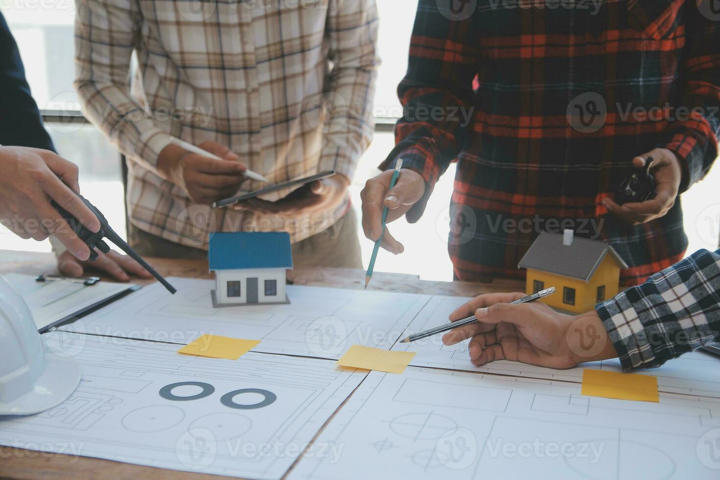 Engineer Teamwork Meeting, Drawing working on blueprint meeting for project working with partner on model building and engineering tools in working site, Construction and structure concept. photo