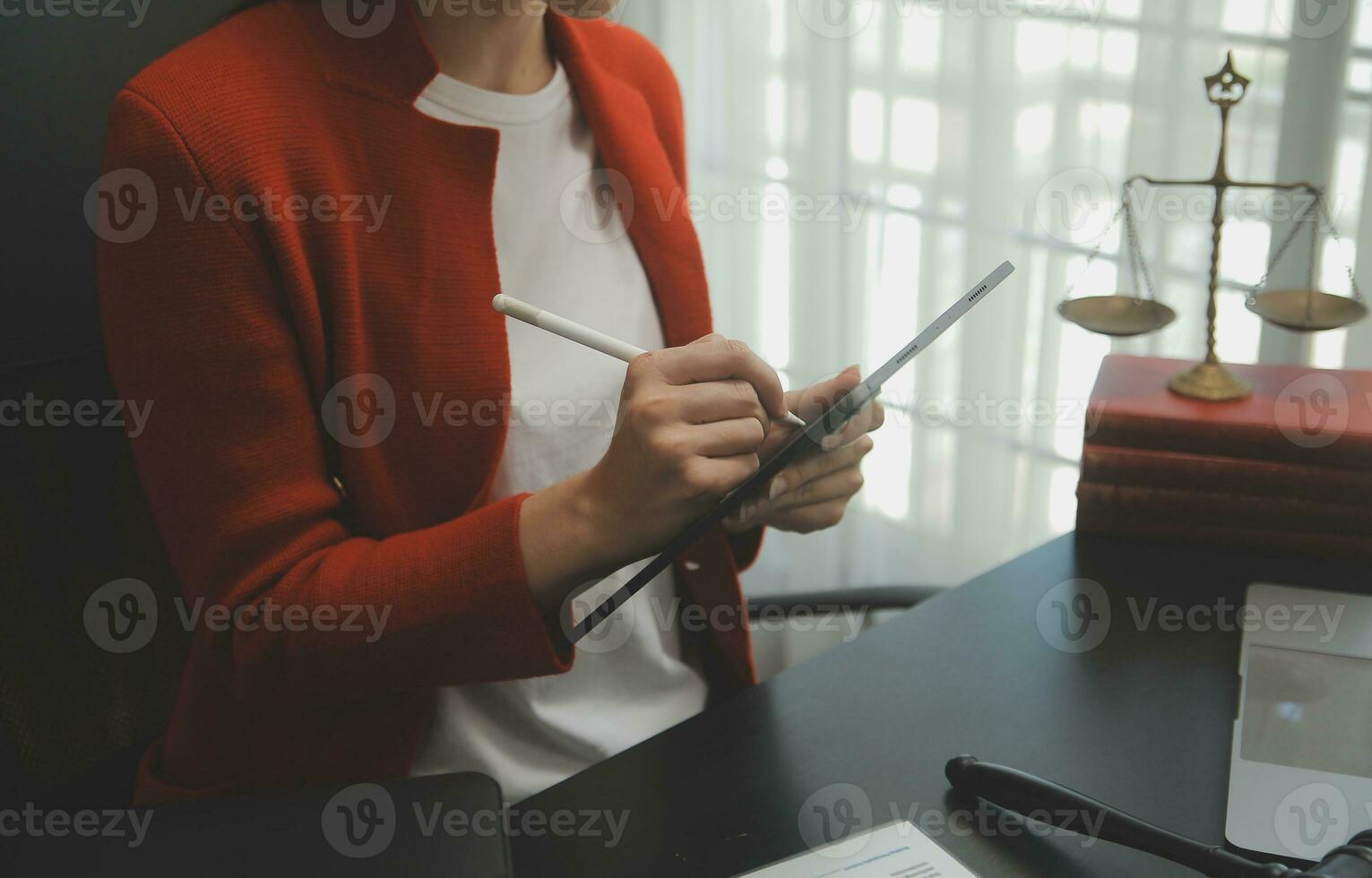 Business and lawyers discussing contract papers with brass scale on desk in office. Law, legal services, advice, justice and law concept picture with film grain effect photo