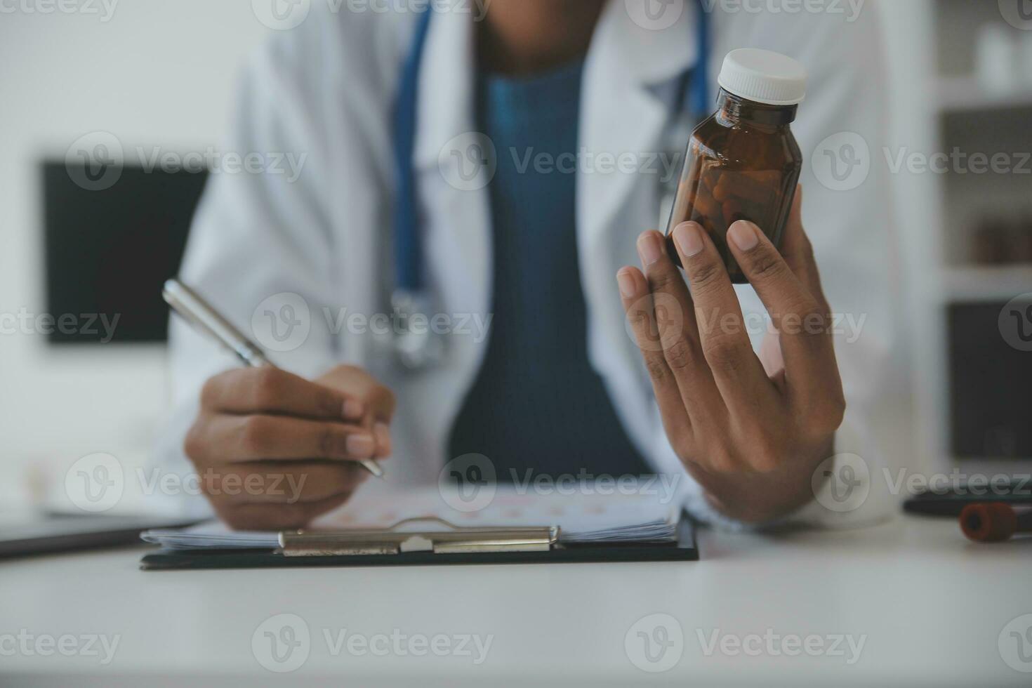 Professional lab. Amazing longhaired medical worker wearing uniform while using microscope during research photo