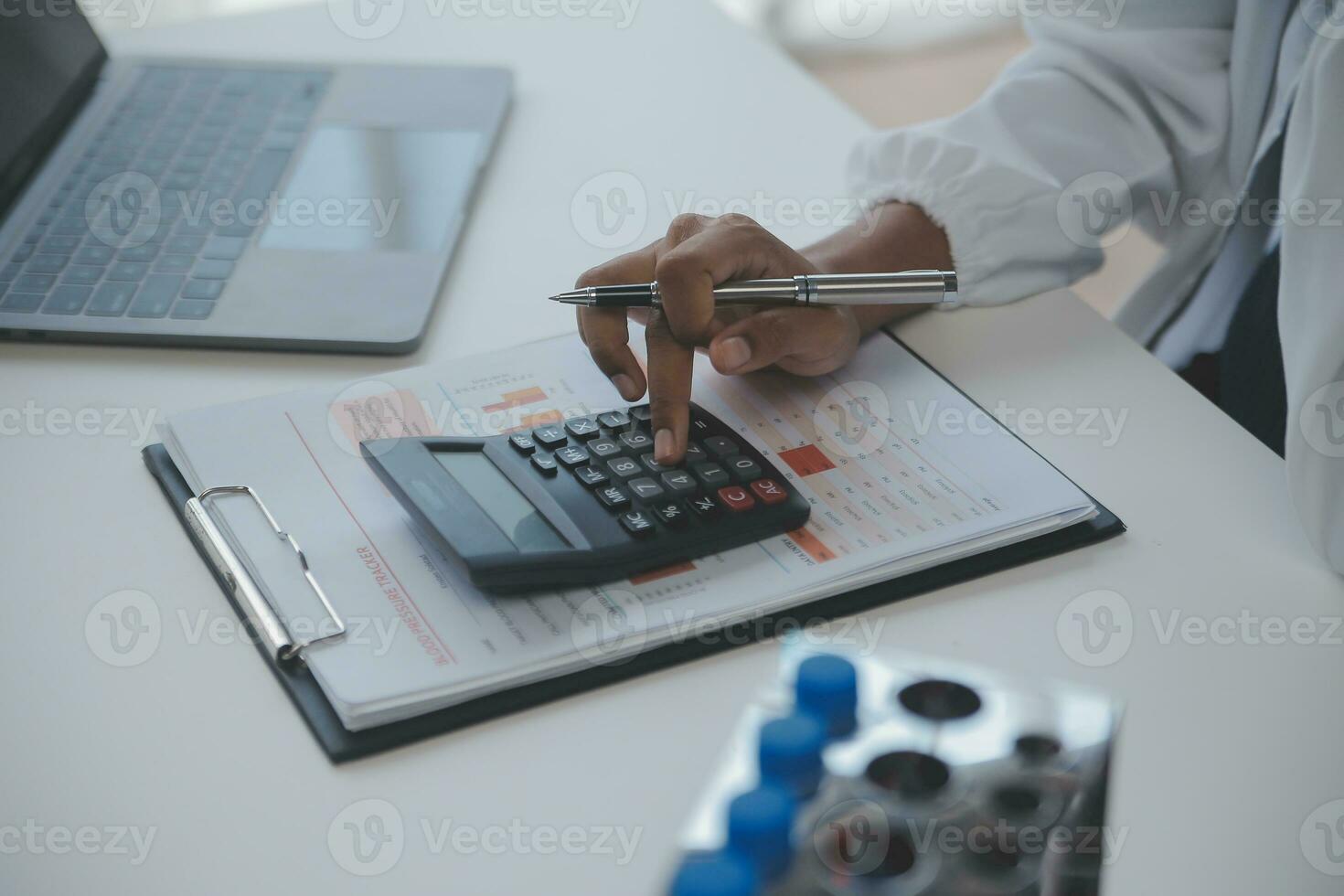 Professional lab. Amazing longhaired medical worker wearing uniform while using microscope during research photo