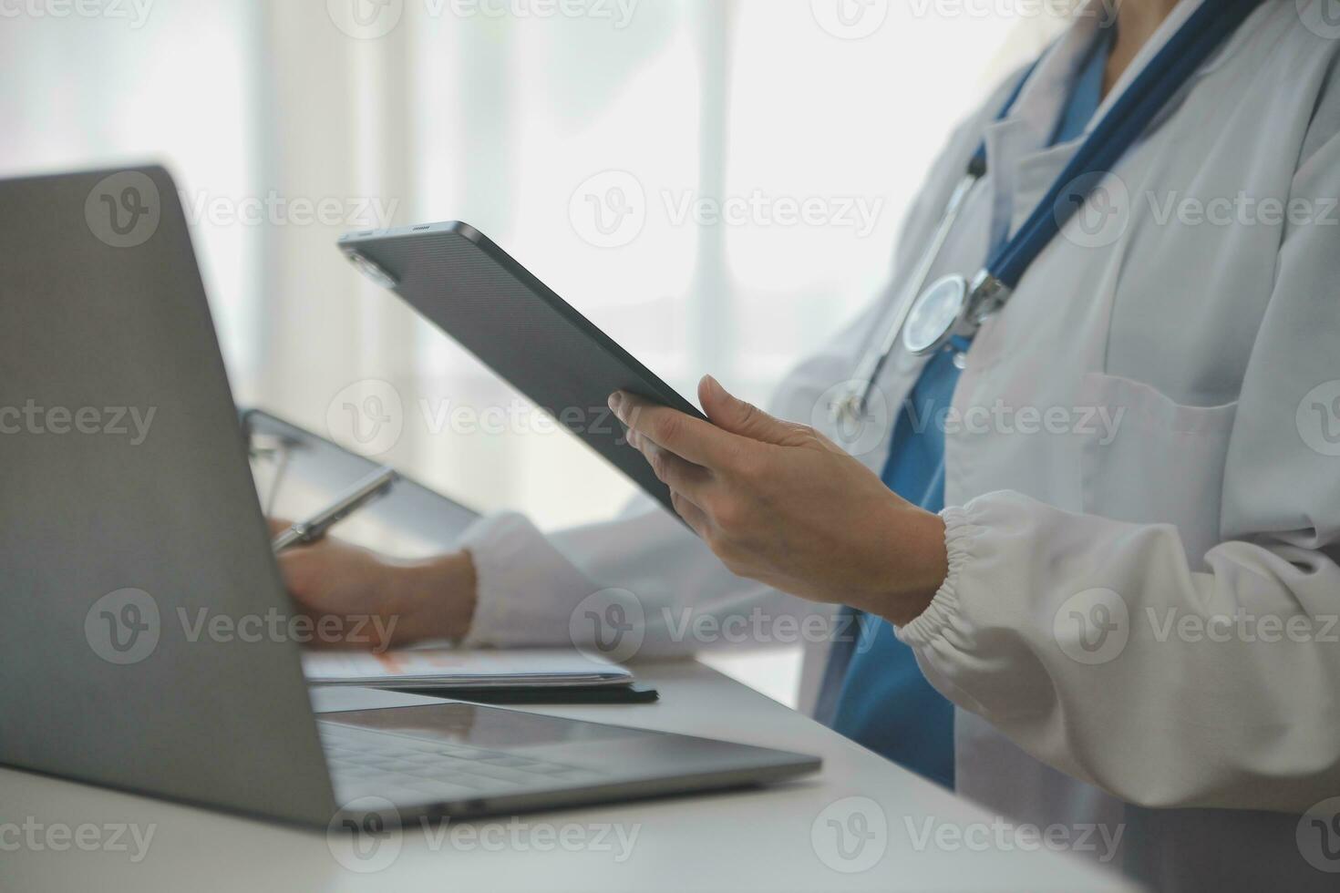 Professional lab. Amazing longhaired medical worker wearing uniform while using microscope during research photo