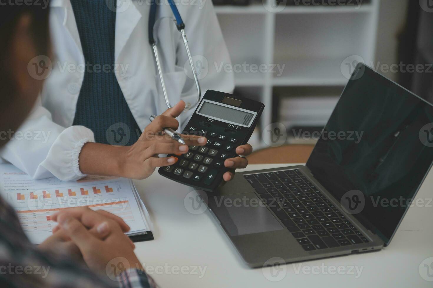 Professional lab. Amazing longhaired medical worker wearing uniform while using microscope during research photo