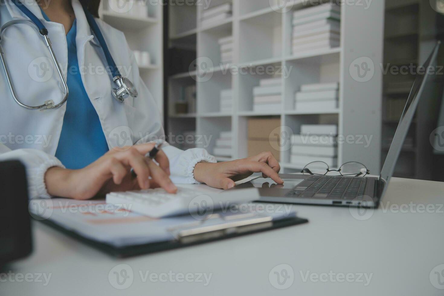 Professional lab. Amazing longhaired medical worker wearing uniform while using microscope during research photo
