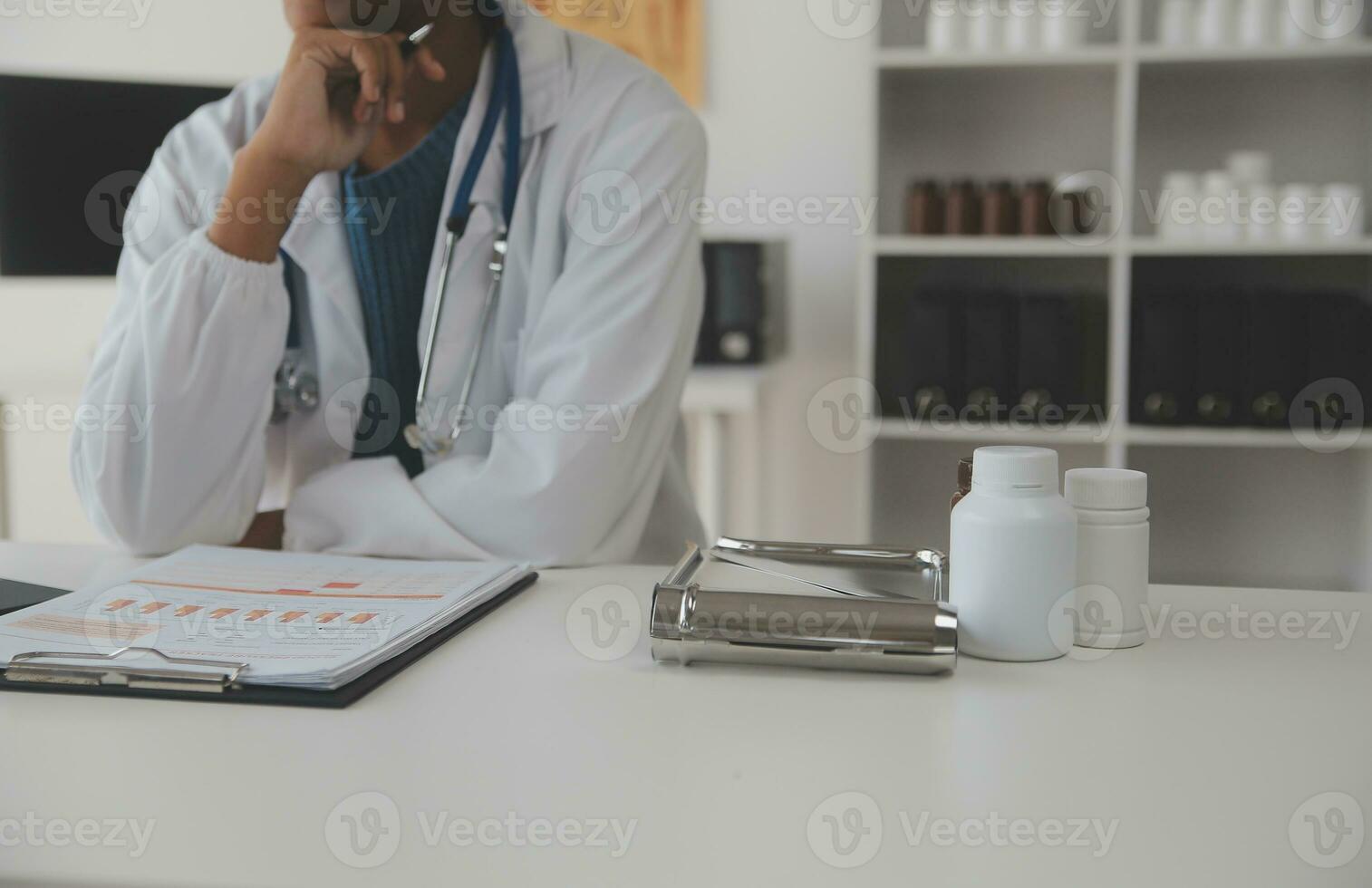 Professional lab. Amazing longhaired medical worker wearing uniform while using microscope during research photo