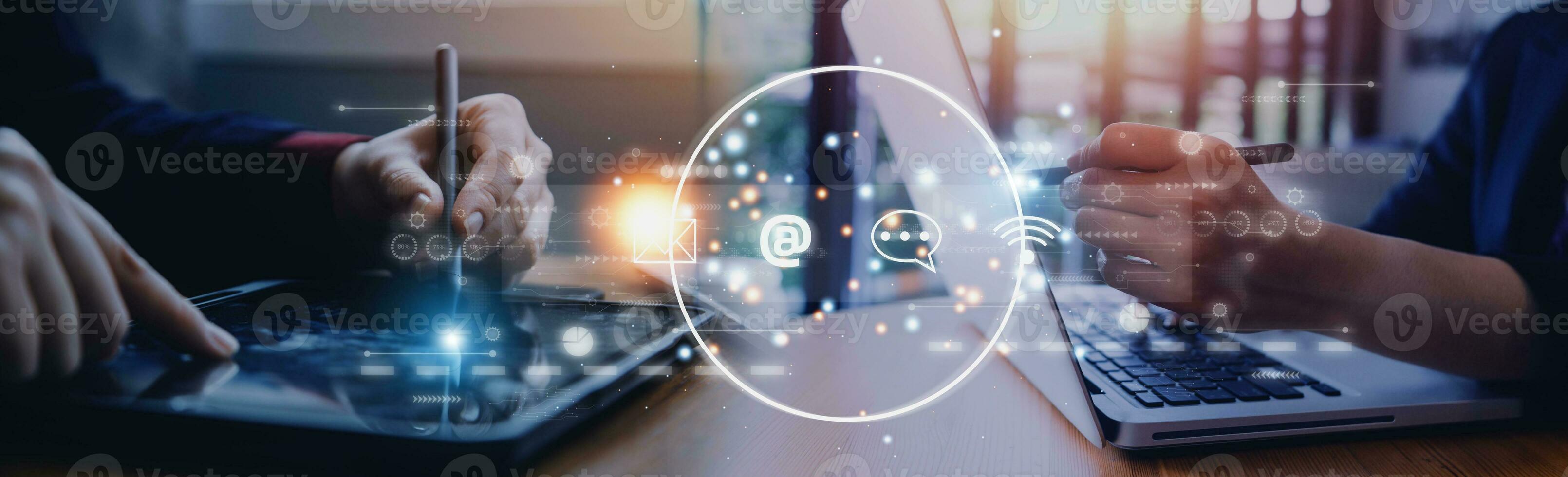 Contact us or Customer support hotline people connect. Businessman using a laptop and touching on virtual screen contact icons email, address, live chat, internet wifi . photo