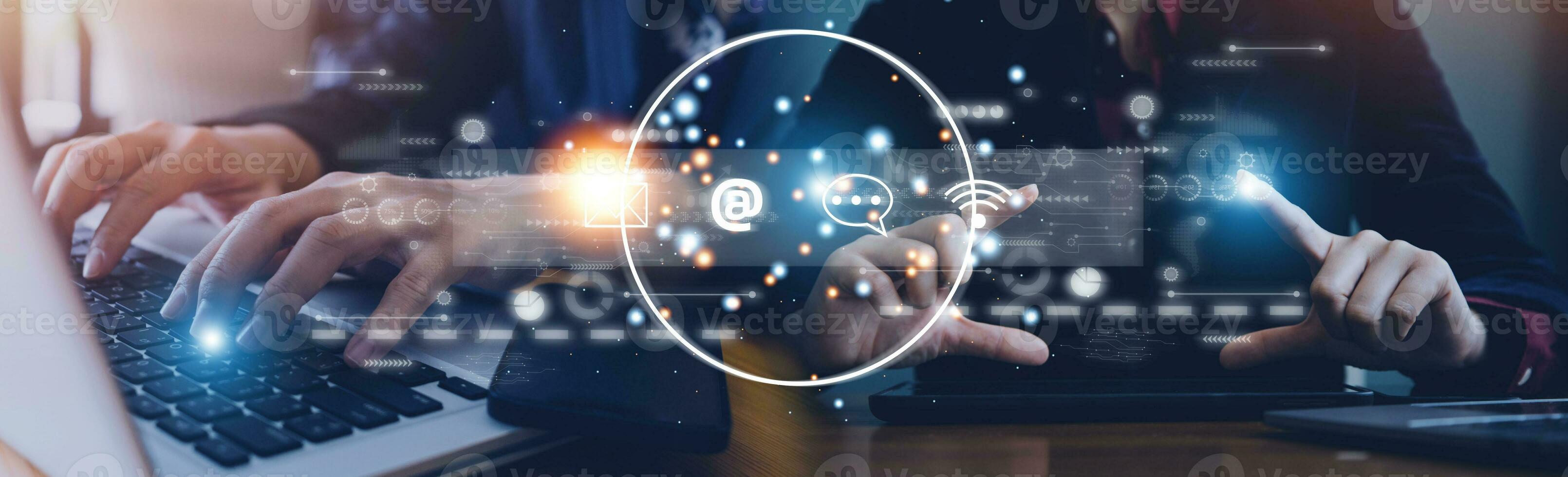 Contact us or Customer support hotline people connect. Businessman using a laptop and touching on virtual screen contact icons email, address, live chat, internet wifi photo