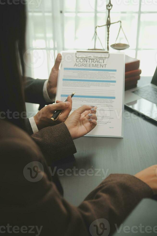 Judge gavel with Justice lawyers having team meeting at law firm background. Concepts of Law and Legal services. photo
