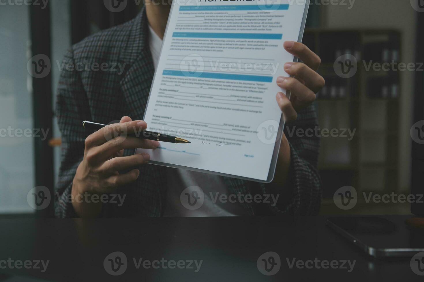 Business and lawyers discussing contract papers with brass scale on desk in office. Law, legal services, advice, justice and law concept picture with film grain effect photo