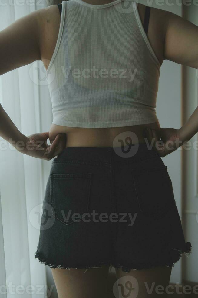 Fat woman measuring , fat woman fat belly chubby paunchy sport recreation health care lose belly fat do not exercise concept photo