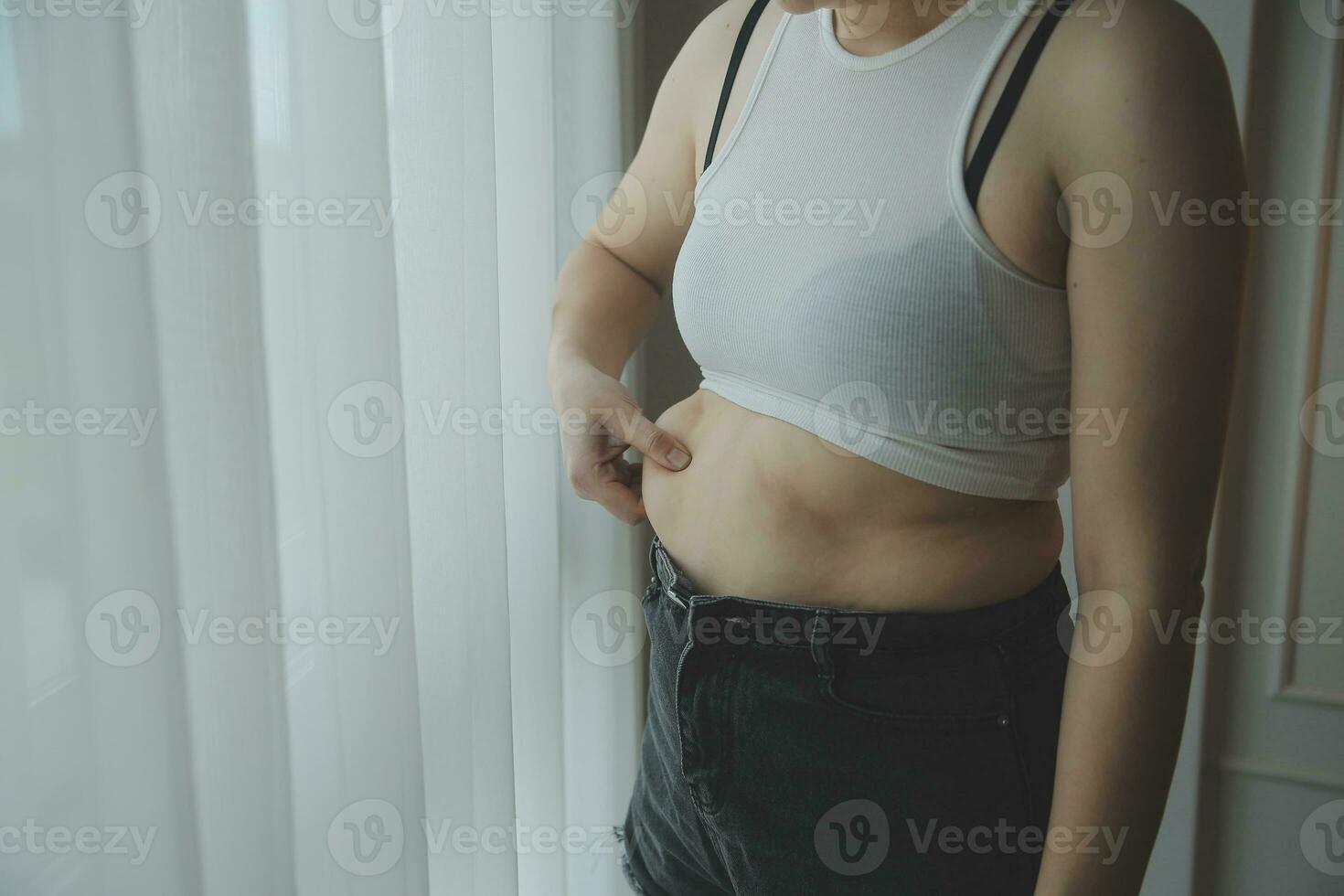 Fat woman measuring , fat woman fat belly chubby paunchy sport recreation health care lose belly fat do not exercise concept photo