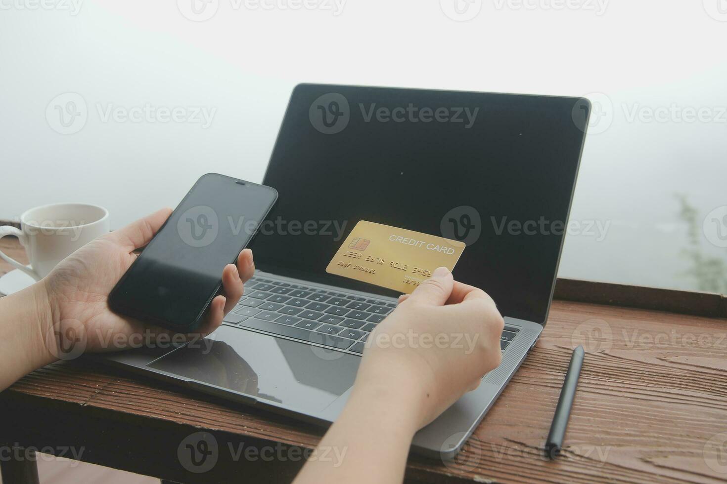 online payment, young woman holding credit card and touching on smartphone screen, copy space photo