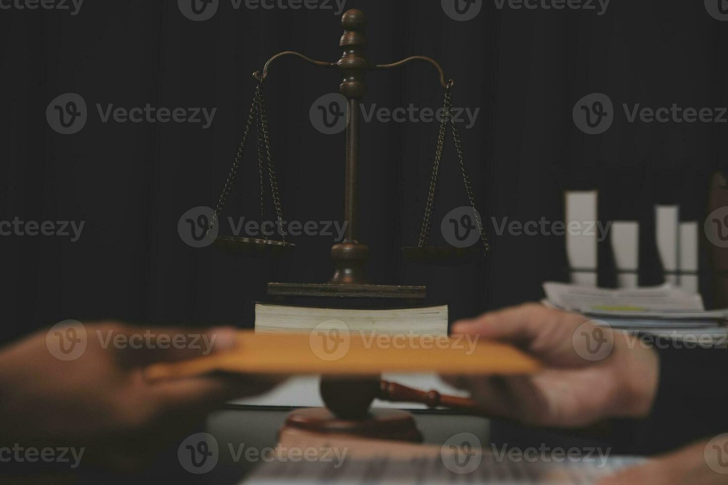 Business and lawyers discussing contract papers with brass scale on desk in office. Law, legal services, advice, justice and law concept picture with film grain effect photo