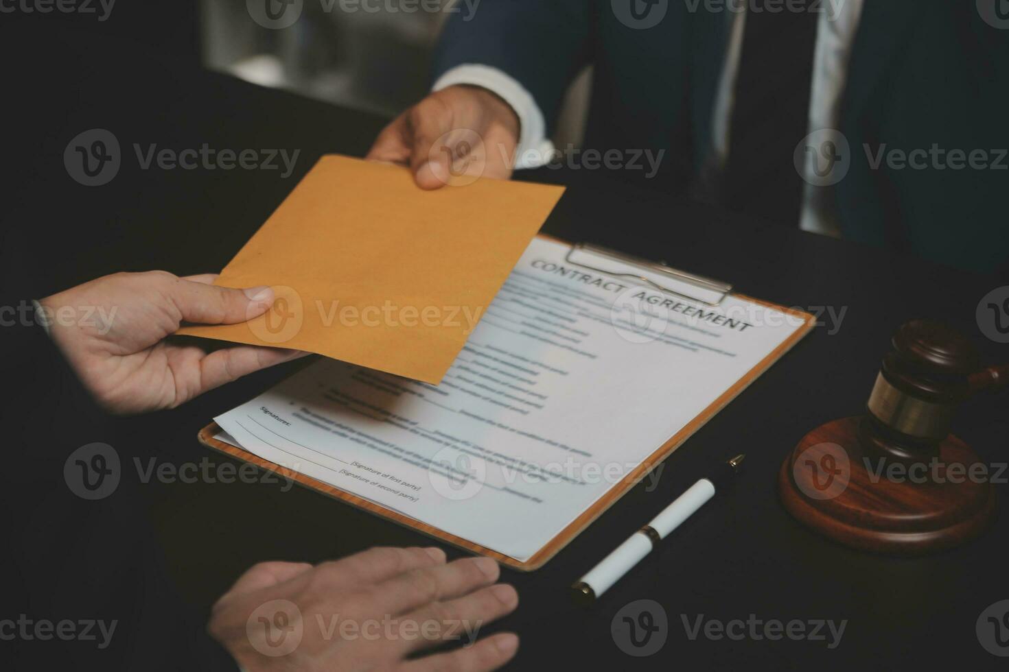 Business and lawyers discussing contract papers with brass scale on desk in office. Law, legal services, advice, justice and law concept picture with film grain effect photo