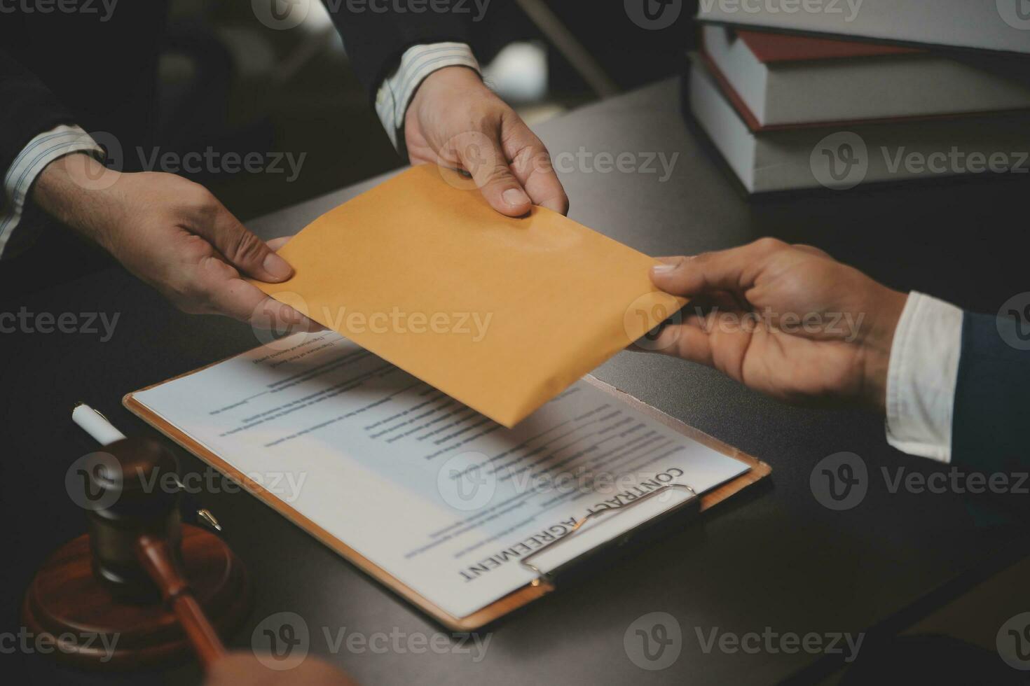 Business and lawyers discussing contract papers with brass scale on desk in office. Law, legal services, advice, justice and law concept picture with film grain effect photo