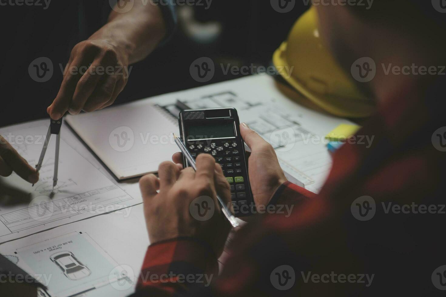 Engineer Teamwork Meeting, Drawing working on blueprint meeting for project working with partner on model building and engineering tools in working site, Construction and structure concept. photo