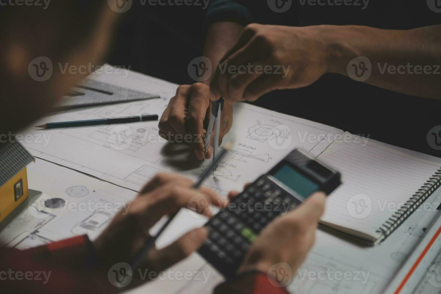 Engineer Teamwork Meeting, Drawing working on blueprint meeting for project working with partner on model building and engineering tools in working site, Construction and structure concept. photo