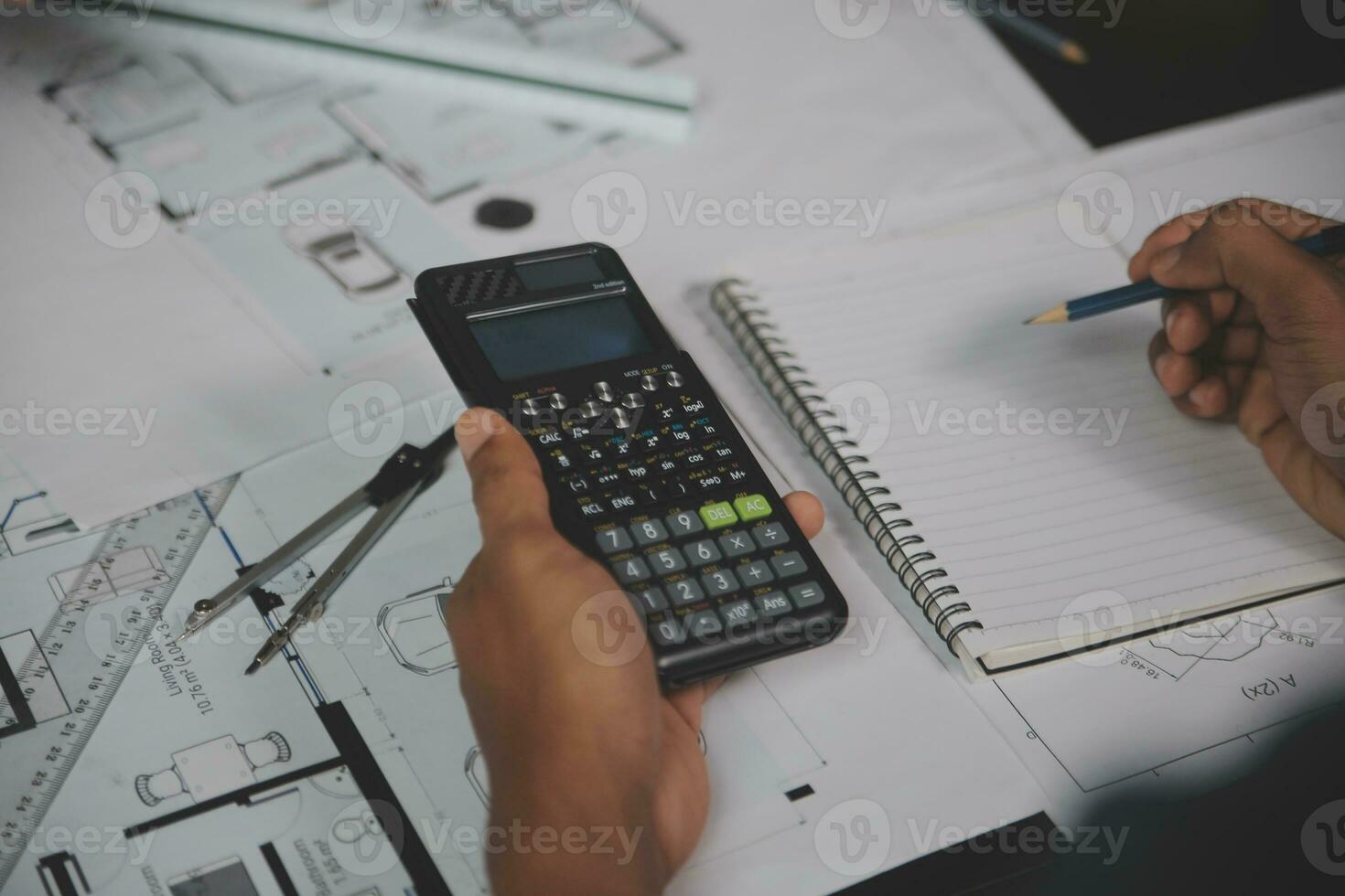 Engineer Teamwork Meeting, Drawing working on blueprint meeting for project working with partner on model building and engineering tools in working site, Construction and structure concept. photo