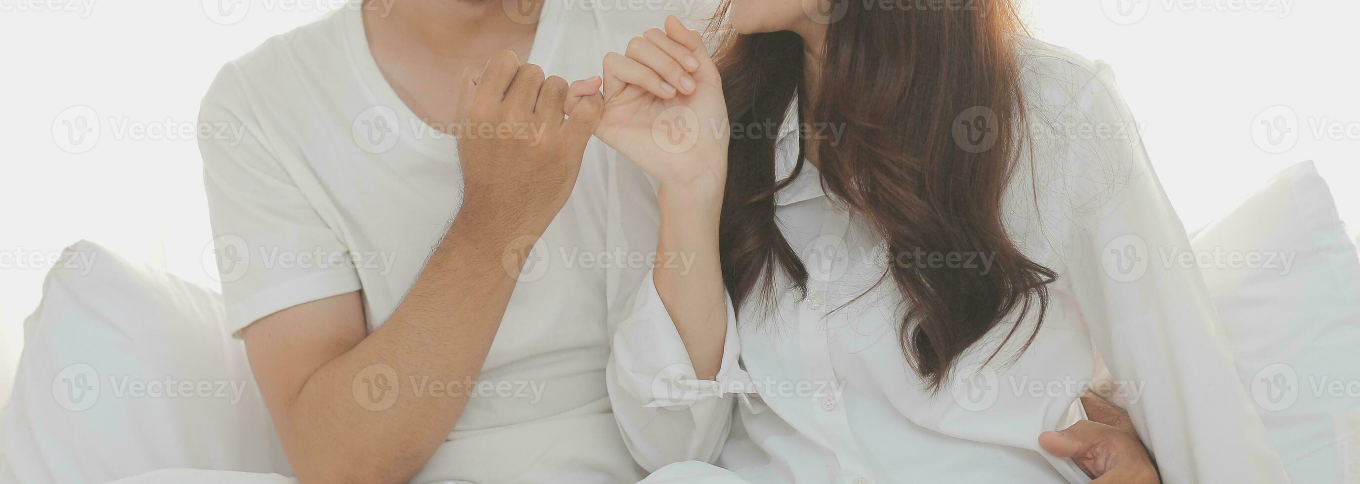 In love new couple at home.Cheerful beautiful young couple relexing on sofa home.Romantict moment.In selective focus. Setup studio shooting. photo