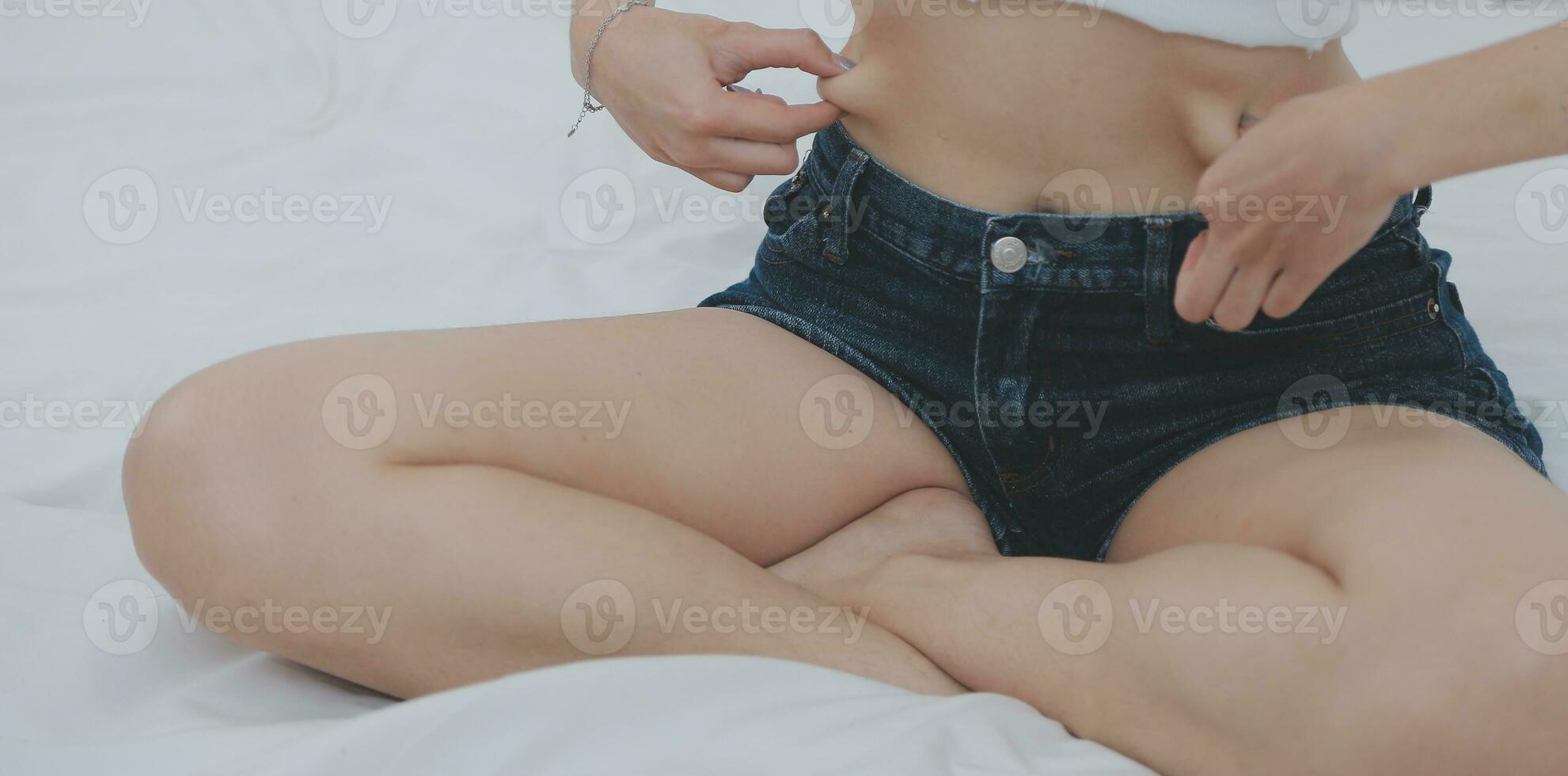 Young attractive girl Spanish appearance delighted with the surprise. And The Morning Started With An Unexpected Healthy Breakfast. In surprise, she waved her hands and rejoices at what is happening. photo