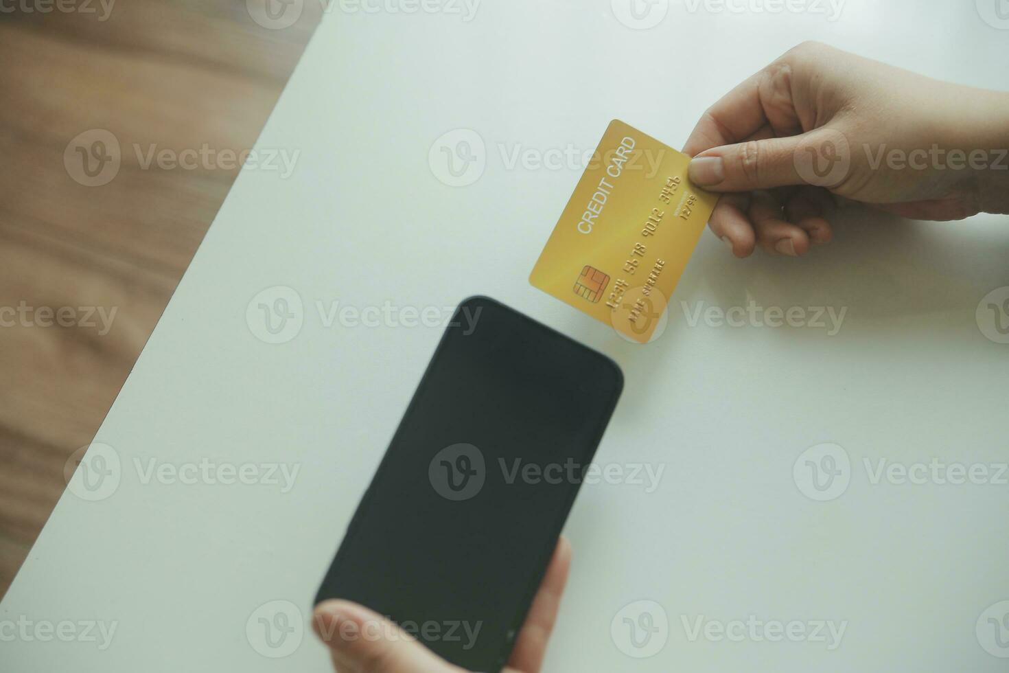 Woman hands holding and using cradit card for shopping online. photo