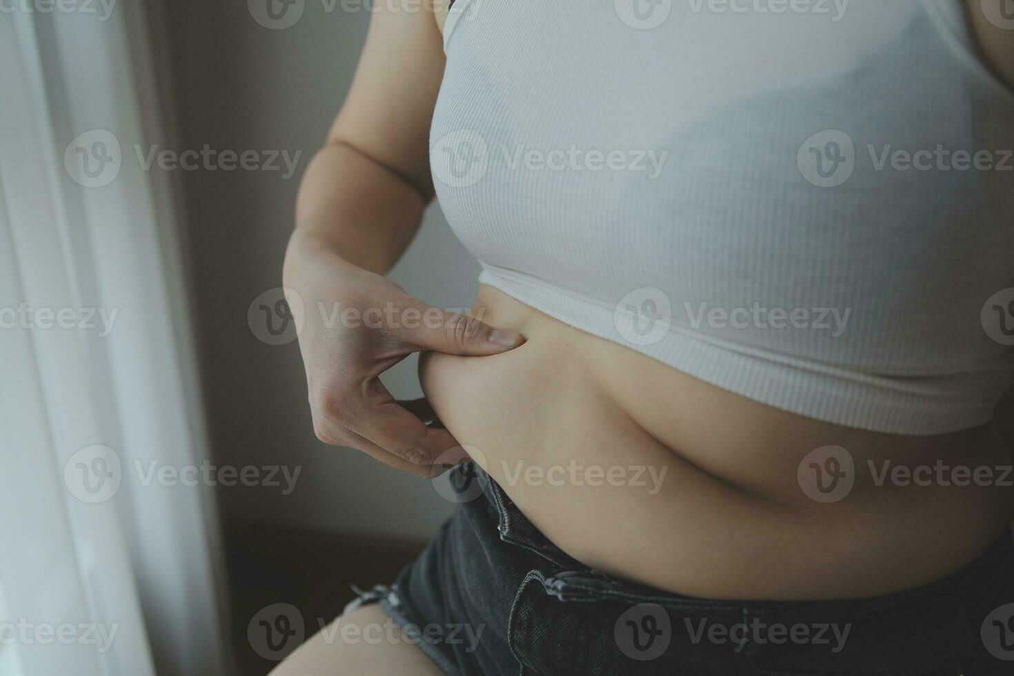 Fat woman measuring , fat woman fat belly chubby paunchy sport recreation health care lose belly fat do not exercise concept photo