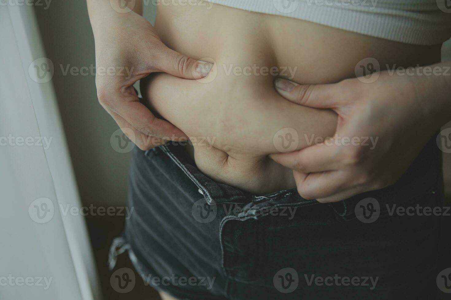 Fat woman measuring , fat woman fat belly chubby paunchy sport recreation health care lose belly fat do not exercise concept photo