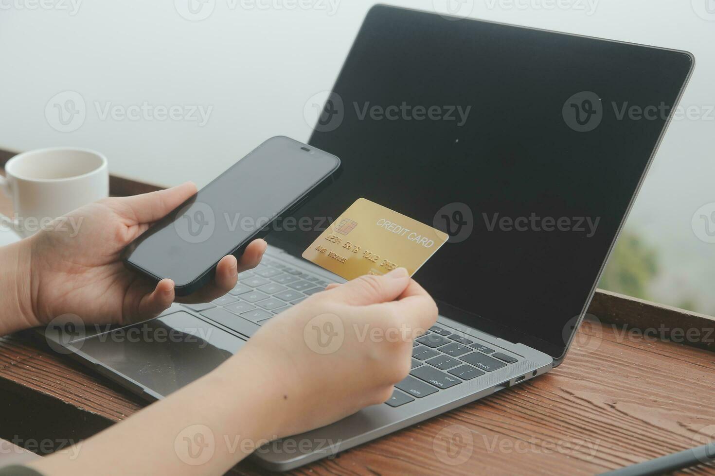 online payment, young woman holding credit card and touching on smartphone screen, copy space photo