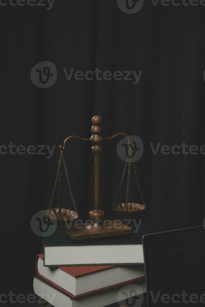 Business and lawyers discussing contract papers with brass scale on desk in office. Law, legal services, advice, justice and law concept picture with film grain effect photo