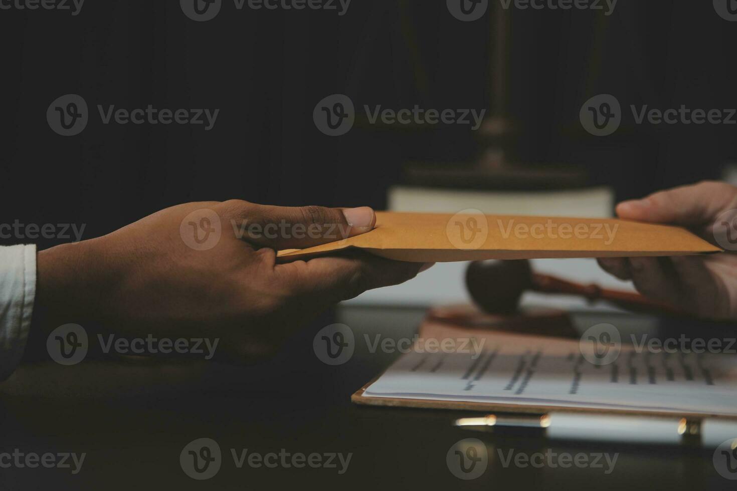 Business and lawyers discussing contract papers with brass scale on desk in office. Law, legal services, advice, justice and law concept picture with film grain effect photo
